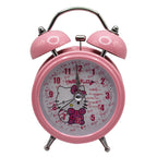 Hello Kitty pink twin bell alarm clock on a bedside table