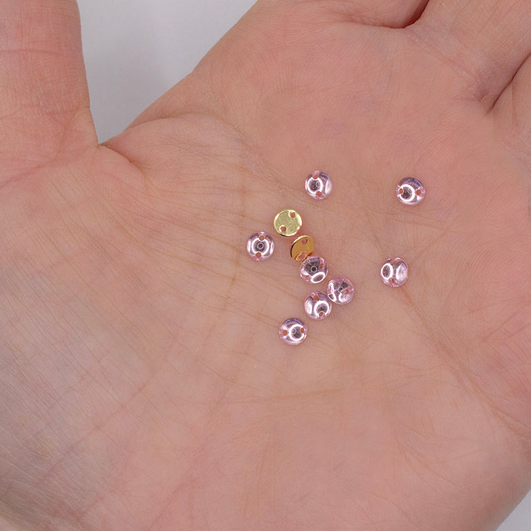 Pack of 40 pink 2-hole sew-on rhinestones displayed on a white background.