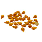 30 amber gold acrylic teardrop rhinestones on a white background.