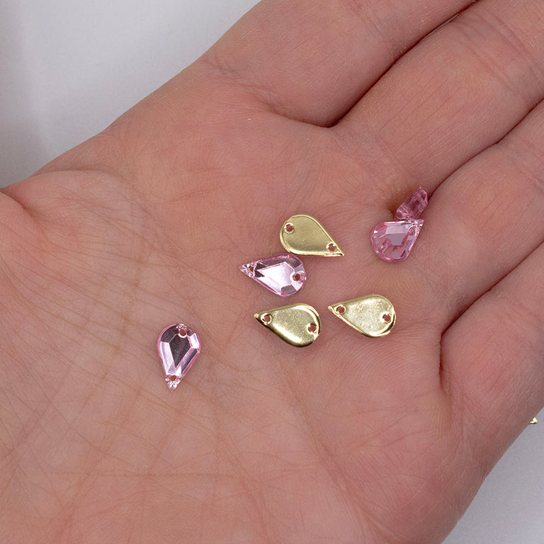 Close-up of a 6x10mm clear white acrylic rhinestone with two holes