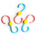 Plastic S-shaped swivel hanger hook in use with clothes