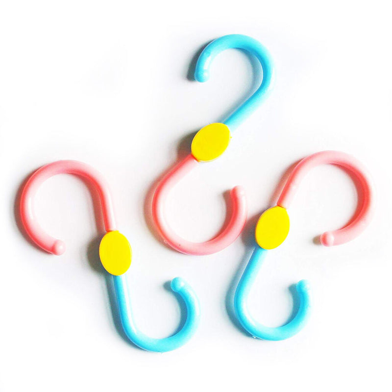 Plastic S-shaped swivel hanger hook in use with clothes