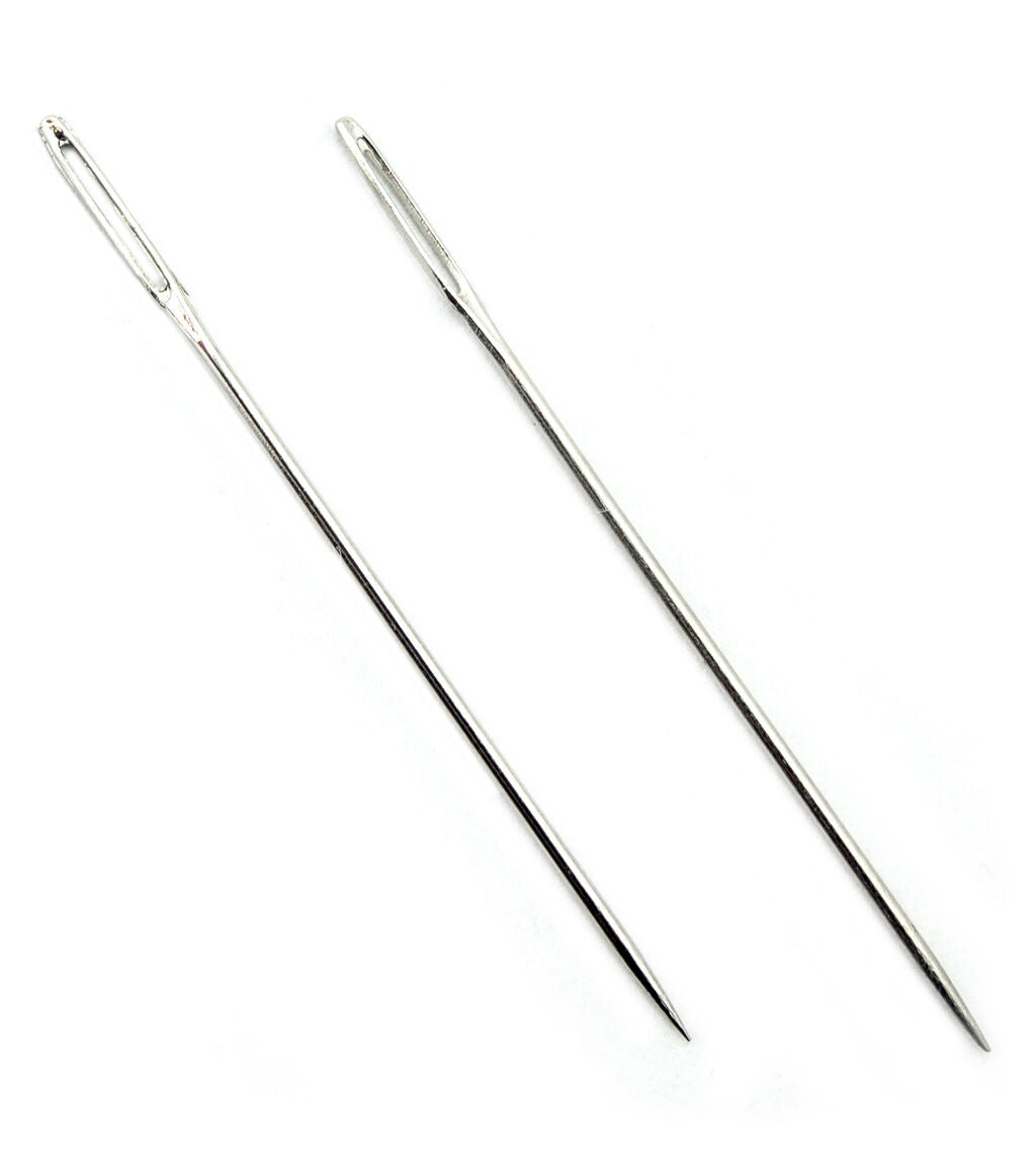 A pair of easy to thread large opening sewing needles, 6cm long.