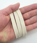 Close-up of 10 mm wide cream flat rope cord trim showing texture.