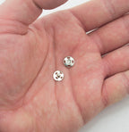 Pack of 100 metal clip buttons displayed on a white background.