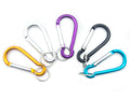 Five assorted carabiner spring snap link hooks in various colours.