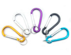 Five assorted carabiner spring snap link hooks in various colours.
