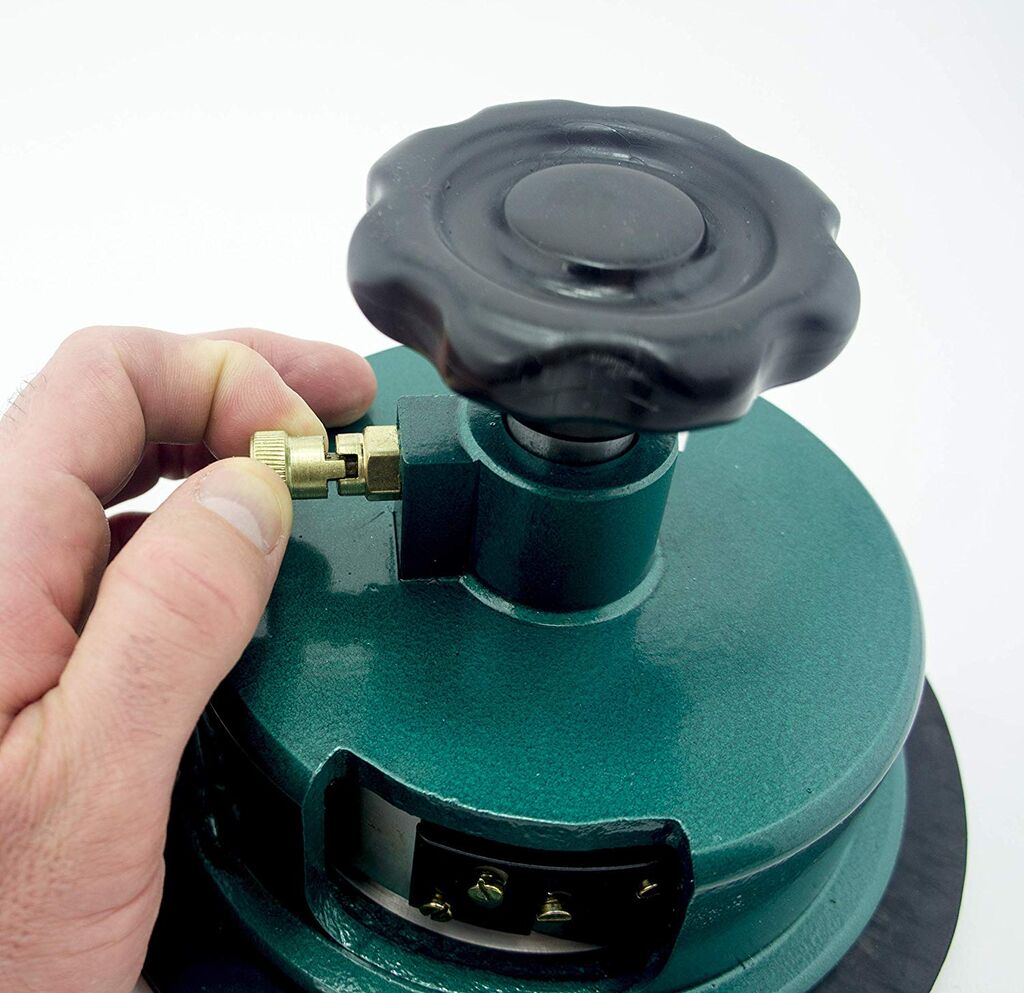 Various materials cut by the round cutter including fabric and paper.