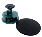 Round cutter for textile GSM sampling on a cutting mat.