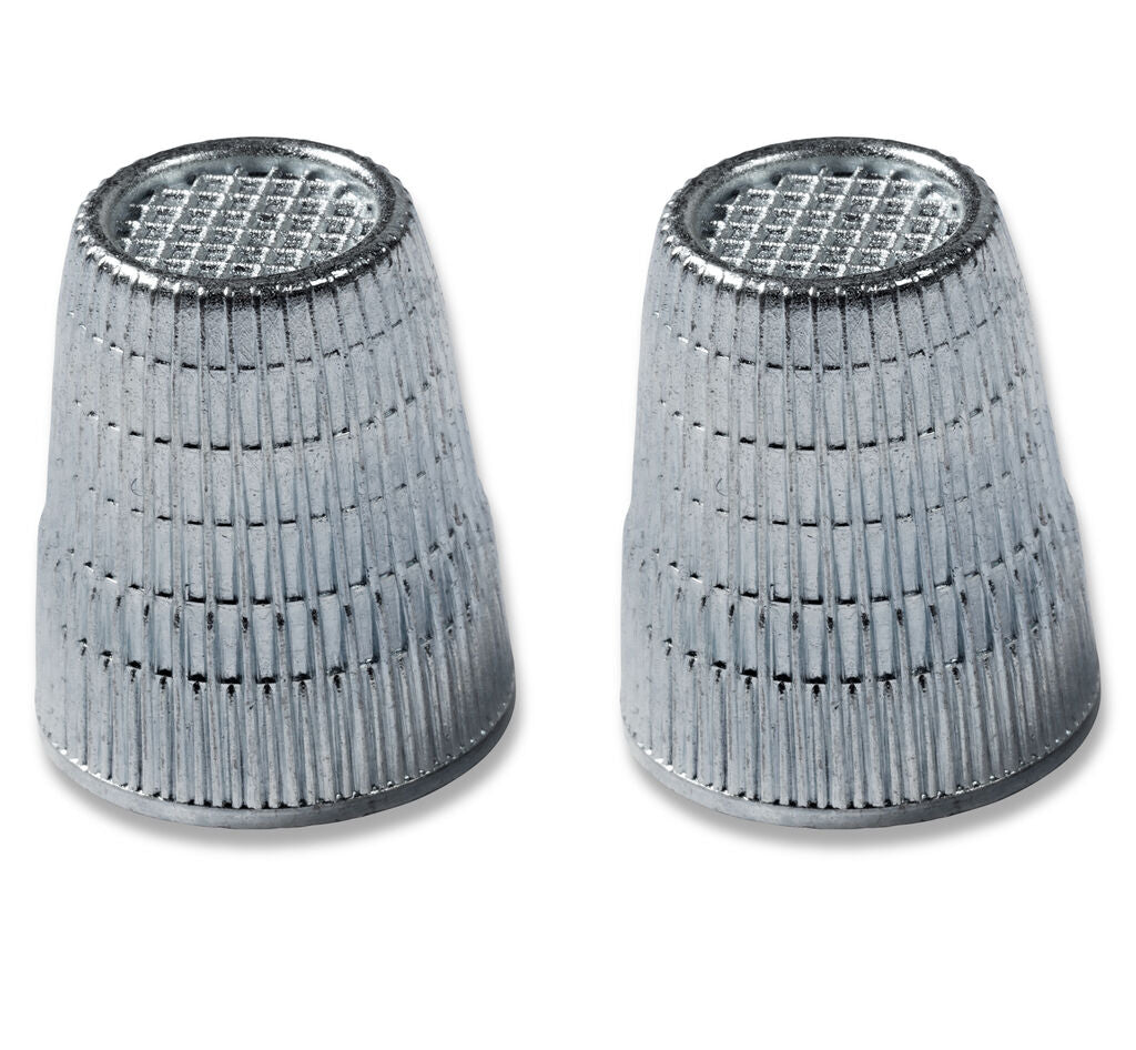 Two Slip-Stop silver finger tip thimbles displayed on a white background.