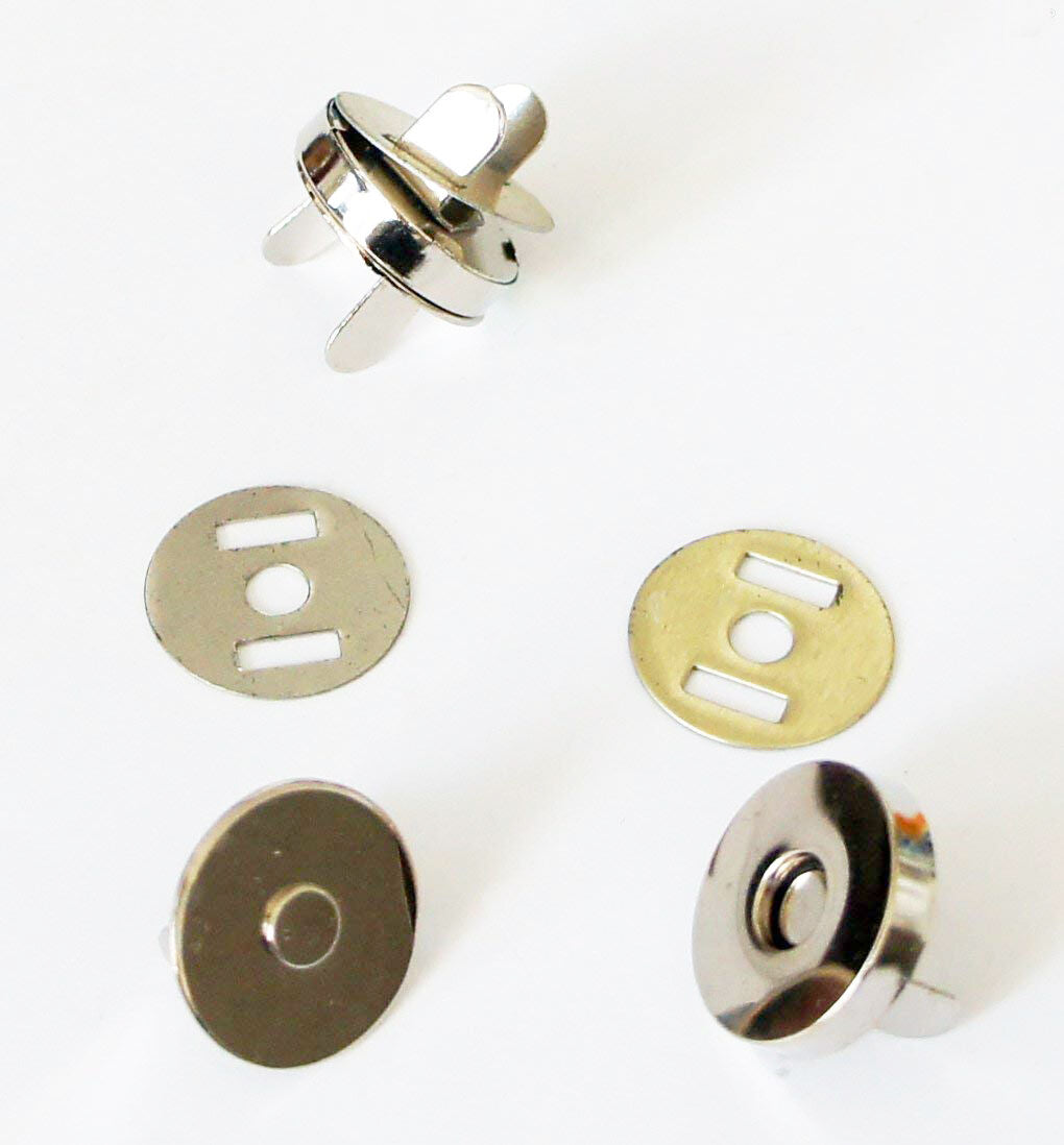 Silver magnetic button set displayed on a white background