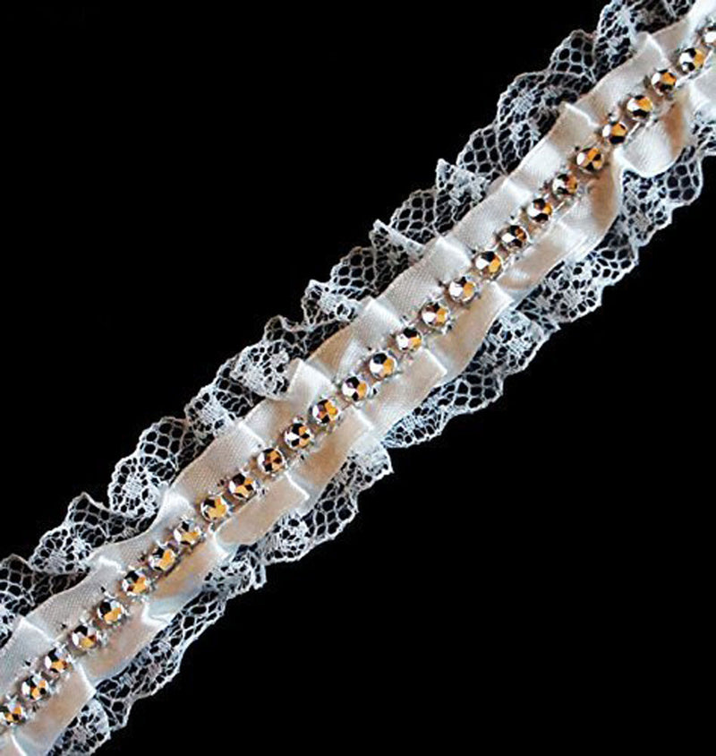 White decorative lace ribbon trim featuring diamante gems.