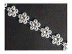 Pretty silver flowers trim displayed on a white background.