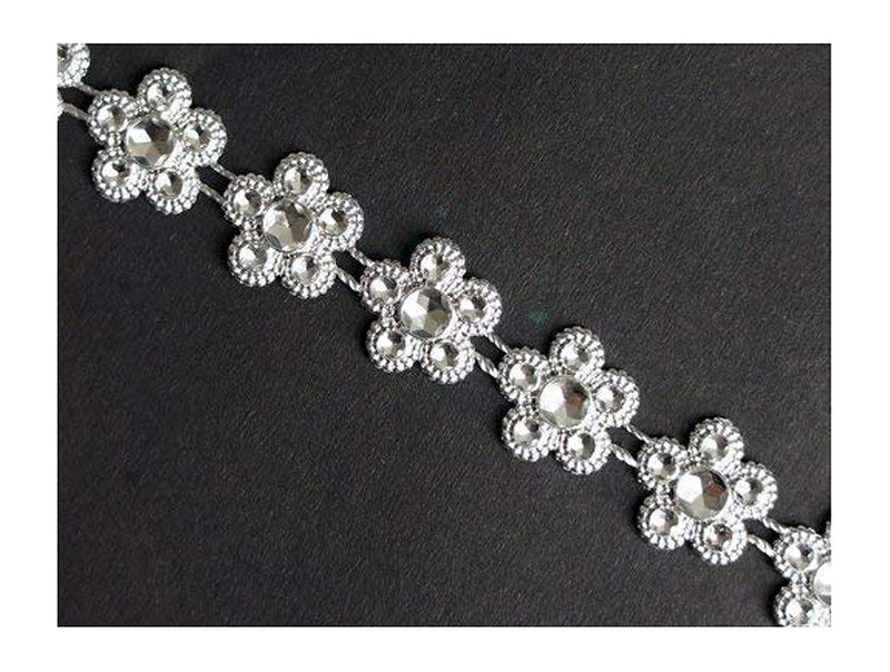 Pretty silver flowers trim displayed on a white background.
