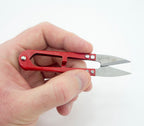 User demonstrating the snips in action on fabric