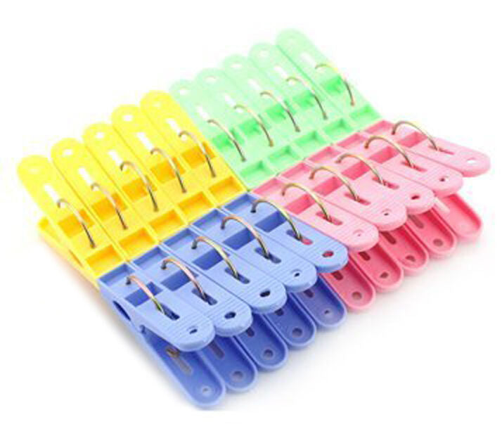 A pack of 16 colourful plastic clothes pegs, 6 cm in length.