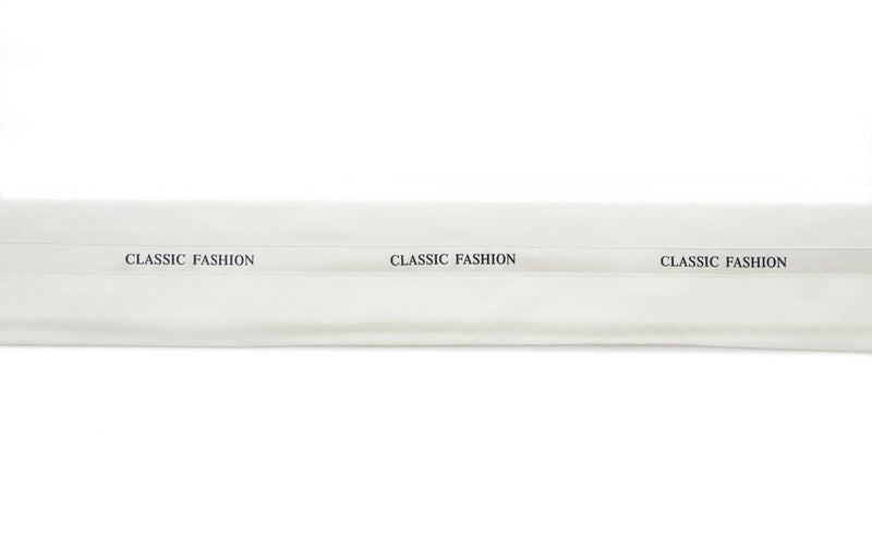 Cream silk satin tailor waist band trim displayed on a roll.