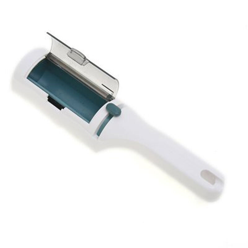 Close-up of lint brush showing trap door for easy emptying.