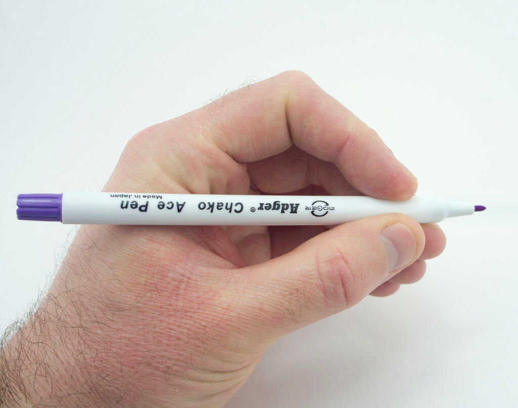 Marker pen demonstrating erasable ink on fabric
