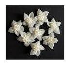 Pack of 8 white decorative flowers with pearl accents.