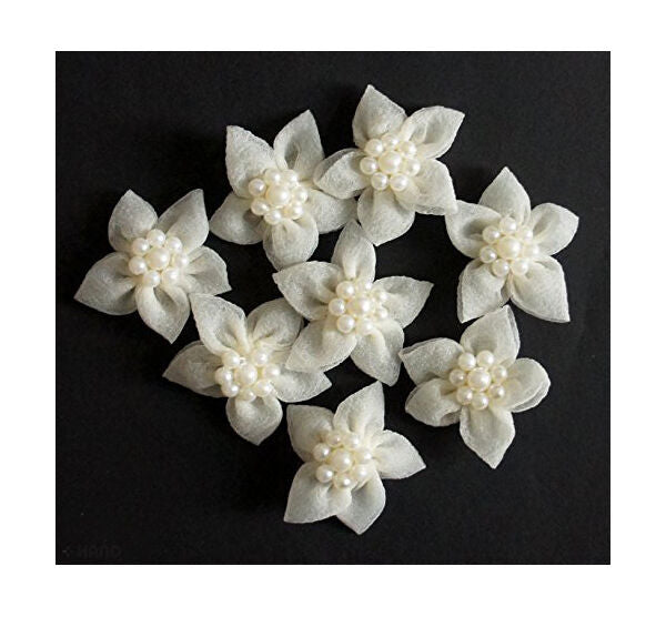 Pack of 8 white decorative flowers with pearl accents.