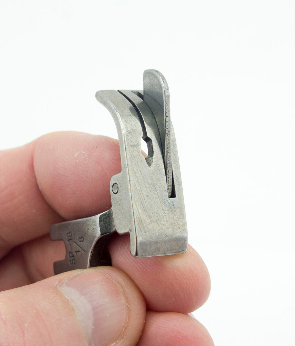 Close-up of the SP-18 sewing machine foot showing details