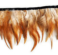 Natural brown and white rooster feather fringe trim on a roll.