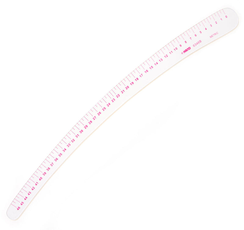 Flexible 46cm metric vary form curve ruler on a flat surface