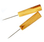 Two medium duty wooden le clickers awls on a white background.