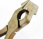 Pliers being used to secure leather materials together