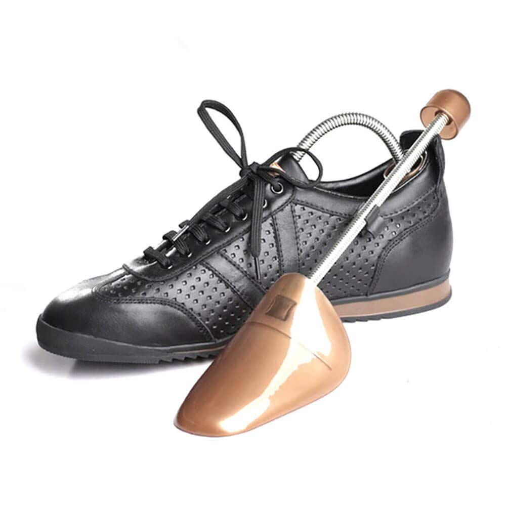 Two strong sprung shoe expanders in brown and silver metal