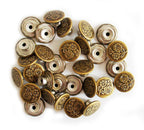 Vintage gold flower design jeans button on a white background