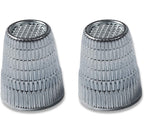 Two Slip-Stop silver finger tip thimbles on a white background.
