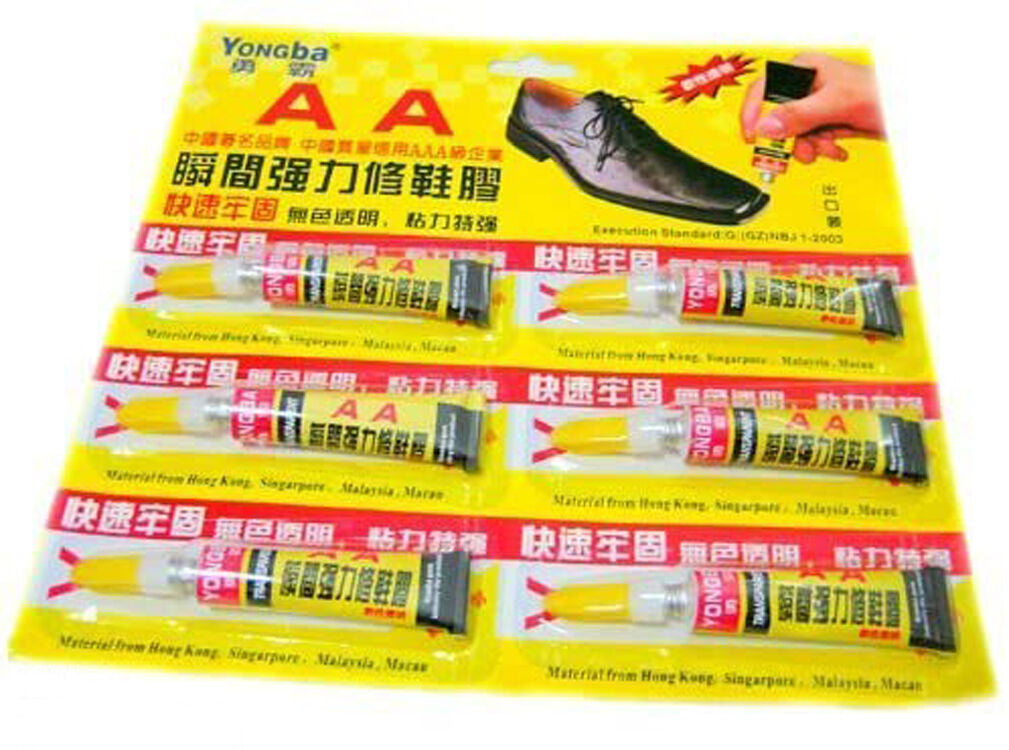 Set of 6 transparent shoe repair glue tubes arranged neatly.