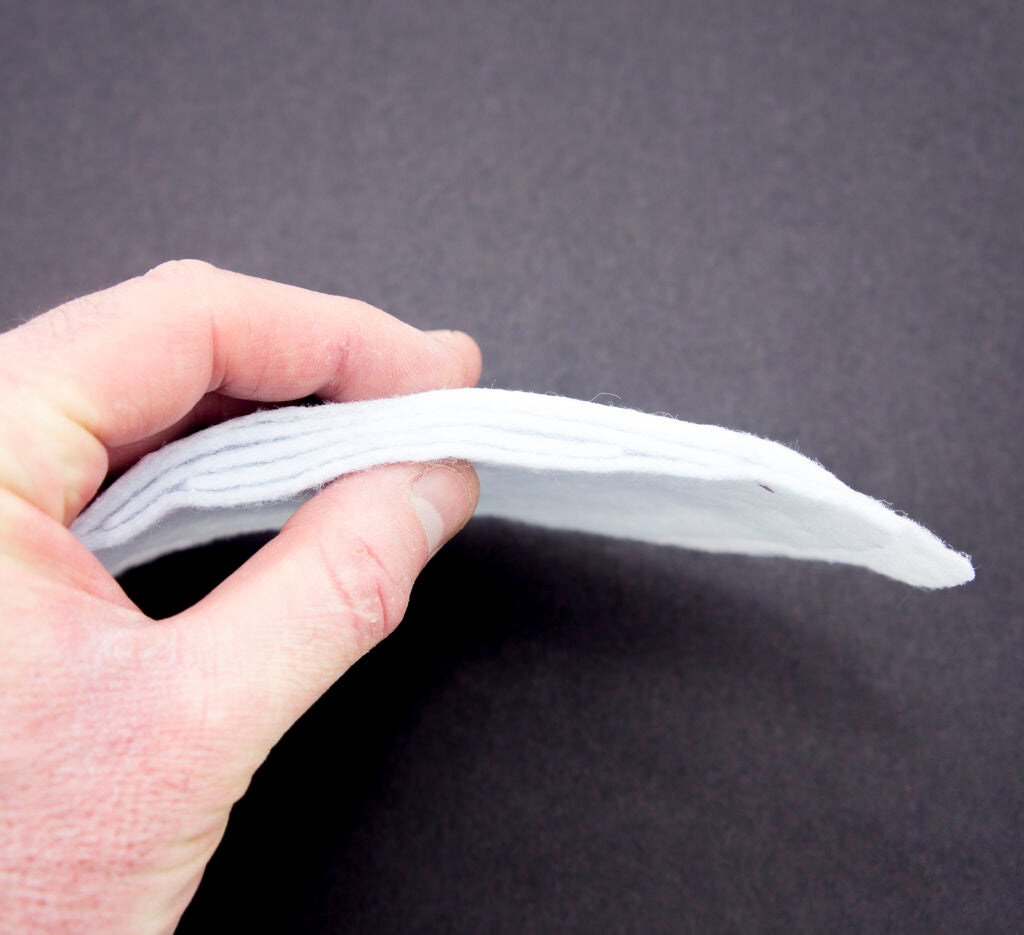 Close-up of narrow width white shoulder pads for sewing