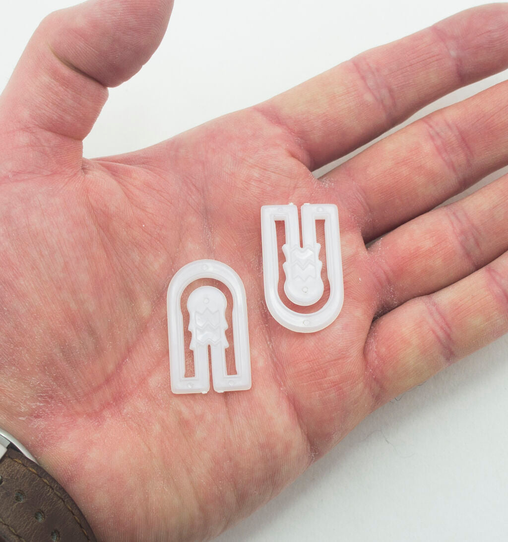 Close-up of U-shape garment clips showing their design