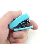 Close-up of the mini stapler in a vibrant colour.