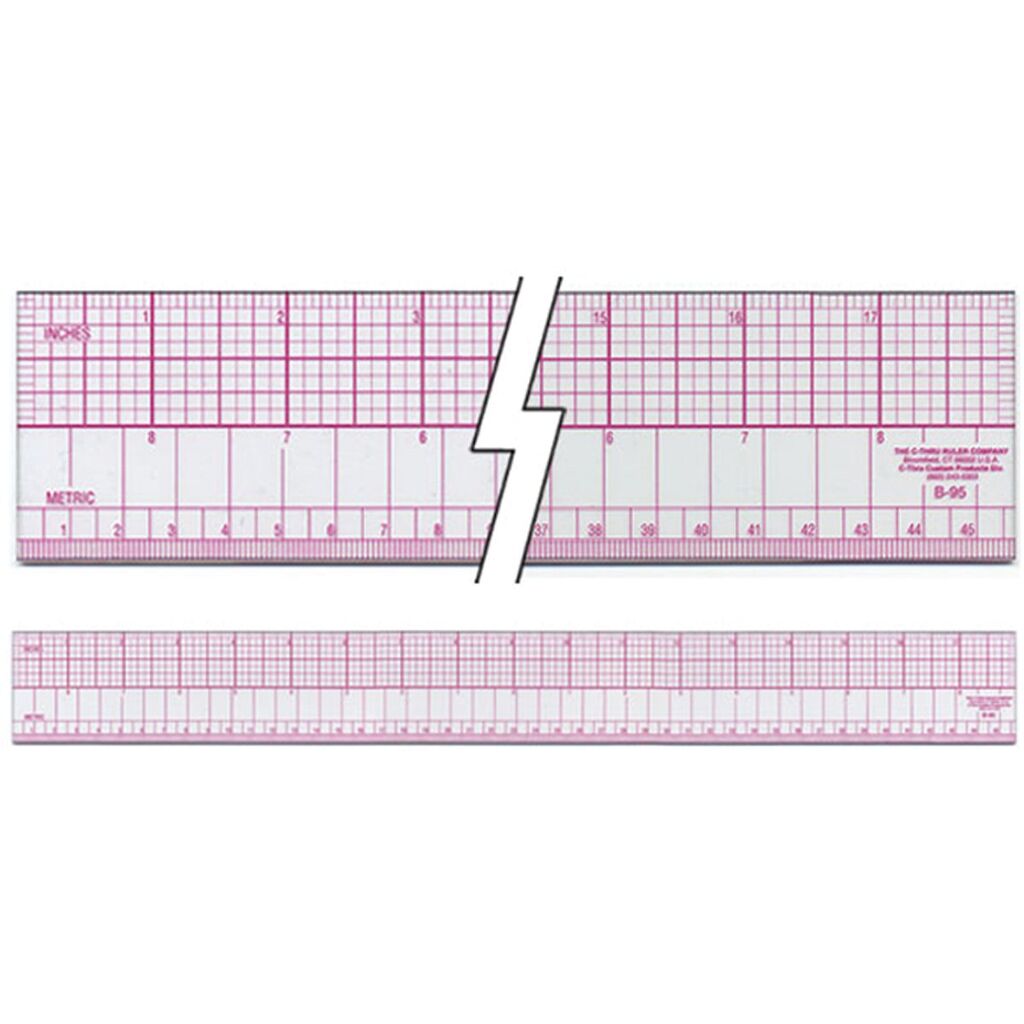 Ruler displayed with sewing patterns and fabric samples