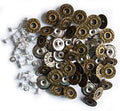 Vintage gold jeans buttons displayed on a white background