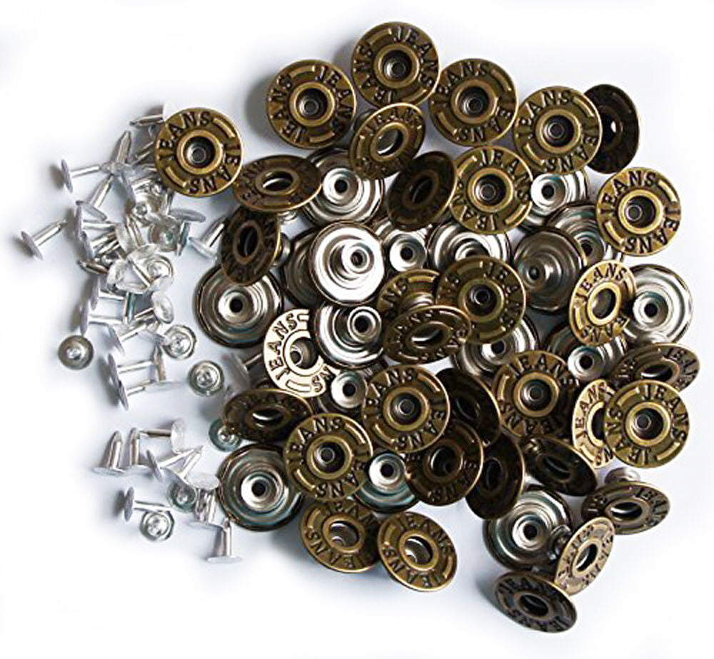 Vintage gold jeans buttons displayed on a white background