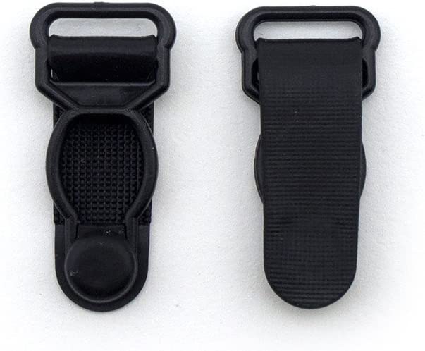 Girdles clips in use on a lingerie garter belt.