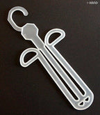 Close-up of a plastic shoe hanger holding a slipper