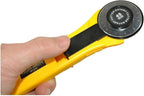 Rotary cutter on a cutting mat with fabric pieces