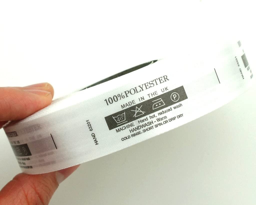 Close-up of polyester wash care labels showing size and details.