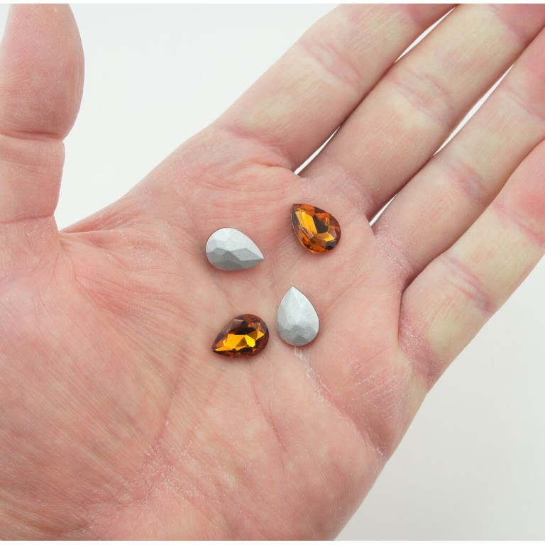 HAND® Dark Amber Crystal Glass Teardrop Sew On Embellishments with Grey Tone Backing - 10 x 14mm - Pack of 50 HAND® Dark Amber Crystal Glass Teardrop Sew On Embellishments with Grey Tone Backing - 10 x 14mm - Pack of 50